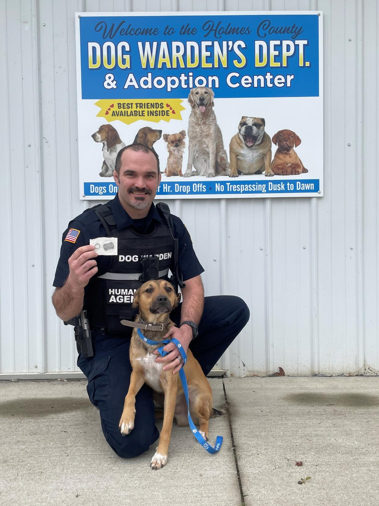 Dog Warden Jonathan Beam is pictured with Bugs, who is available for adoption at the Holmes County Dog Warden’s Department and Adoption Center.
