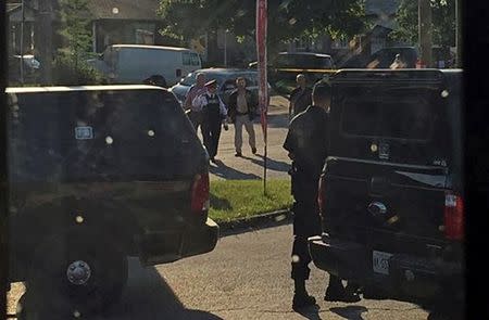 Police raid a home after they received "credible information of a potential terrorist threat" at a small community some 225 km (140 miles) southwest of Toronto in Strathroy, Ontario, Canada August 10, 2016. REUTERS/Stringer