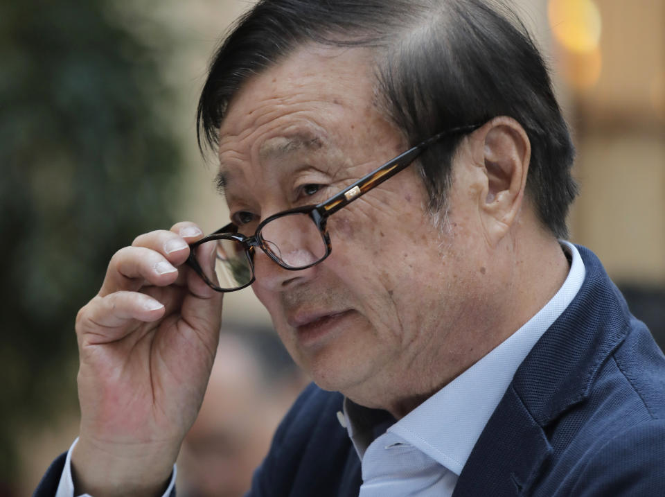 Ren Zhengfei, founder and CEO of Huawei, adjusts his glasses during a round table meeting with the media in Shenzhen city, south China's Guangdong province, Tuesday, Jan. 15, 2019. The founder of network gear and smart phone supplier Huawei Technologies said the tech giant would reject requests from the Chinese government to disclose confidential information about its customers. (AP Photo/Vincent Yu)