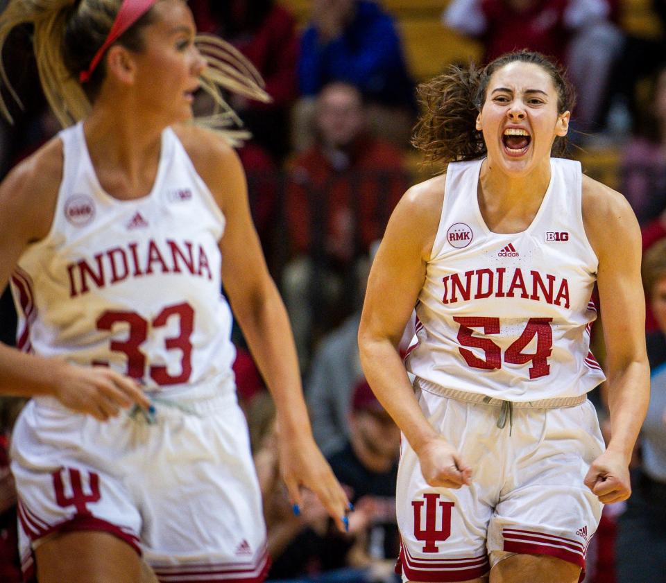 Indiana's Mackenzie Holmes (54) celebrates a basket as she head back up the courth with Sydney Parrish (33) during the first half of the Indiana versus Michigan women's basketball game on Thursday, Jan. 4, 2024.