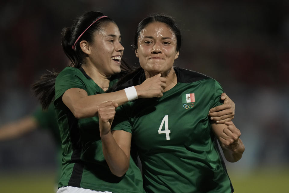 Mexico's Rebeca Bernal, right, celebrate with a teammate after scoring against Chile during a women's soccer gold medal match at the Pan American Games in Valparaiso, Chile, Friday, Nov. 3, 2023. (AP Photo/Eduardo Verdugo)