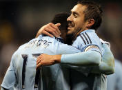 KANSAS CITY, KS - NOVEMBER 02: C.J. Sapong #17 of Sporting Kansas City is congratulated by Davy Arnaud #22 after scoring during the MLS playoff game against the Colorado Rapids on November 2, 2011 at LiveStrong Sporting Park in Kansas City, Kansas. (Photo by Jamie Squire/Getty Images)