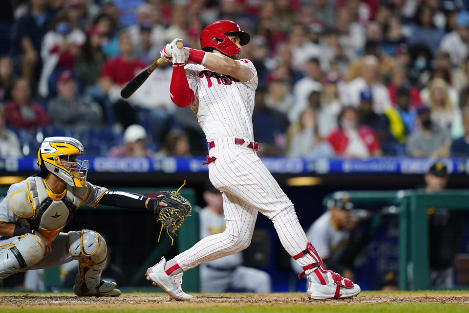 Philadelphia Phillies' Bryce Harper follows though after hitting an RBI-double off Pittsburgh Pirates' Miguel Yajure during the fifth inning of a baseball game, Friday, Sept. 24, 2021, in Philadelphia. (AP Photo/Matt Slocum)