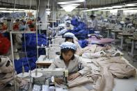 North Korean employees work in a factory of a South Korean company at the Joint Industrial Park in Kaesong industrial zone, a few miles inside North Korea from the heavily fortified border December 19, 2013. Kaesong, with investors from South Korea, was a rare source of hard currency for North Korea. It was established even though North Korea is technically still at war with South Korea, one of the world's richest countries, since the 1950-53 Korean War ended not in a treaty but a truce. Since it opened in 2004, the Kaesong complex has generated about $90 million annually in wages paid directly to the North's state agency that manages the zone. REUTERS/Kim Hong-Ji (NORTH KOREA - Tags: POLITICS BUSINESS EMPLOYMENT)