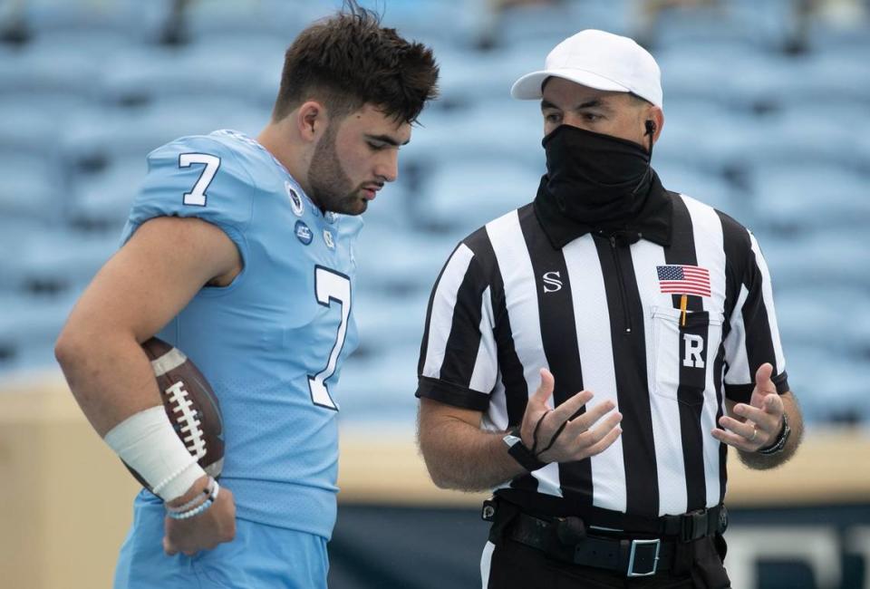 North Carolina quarterback Sam Howell (7) confers with an official prior to the Tar Heel’s game against Syracuse on Saturday, September 12, 2020 in Chapel Hill, N.C.