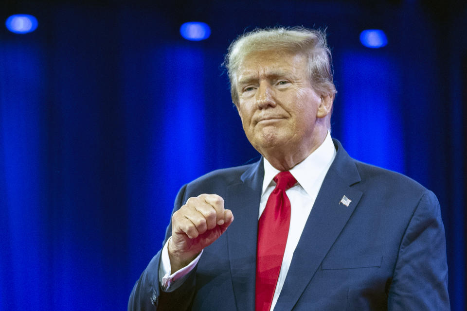 FILE - Republican presidential candidate former President Donald Trump pumps his fist as he departs after speaking during the Conservative Political Action Conference, CPAC 2024, at National Harbor, in Oxon Hill, Md., Feb. 24, 2024. (AP Photo/Alex Brandon, File)