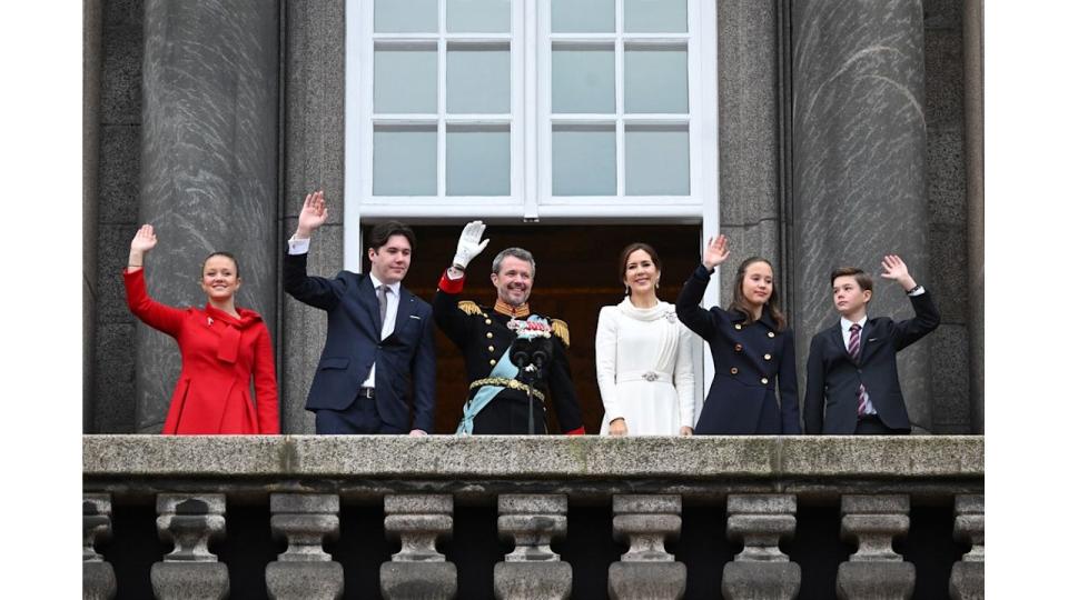 Princess Isabella, Crown Prince Christian, King Frederik X of Denmark, Queen Mary of Denmark, Princess Josephine and Prince Vincent wave after the proclamation