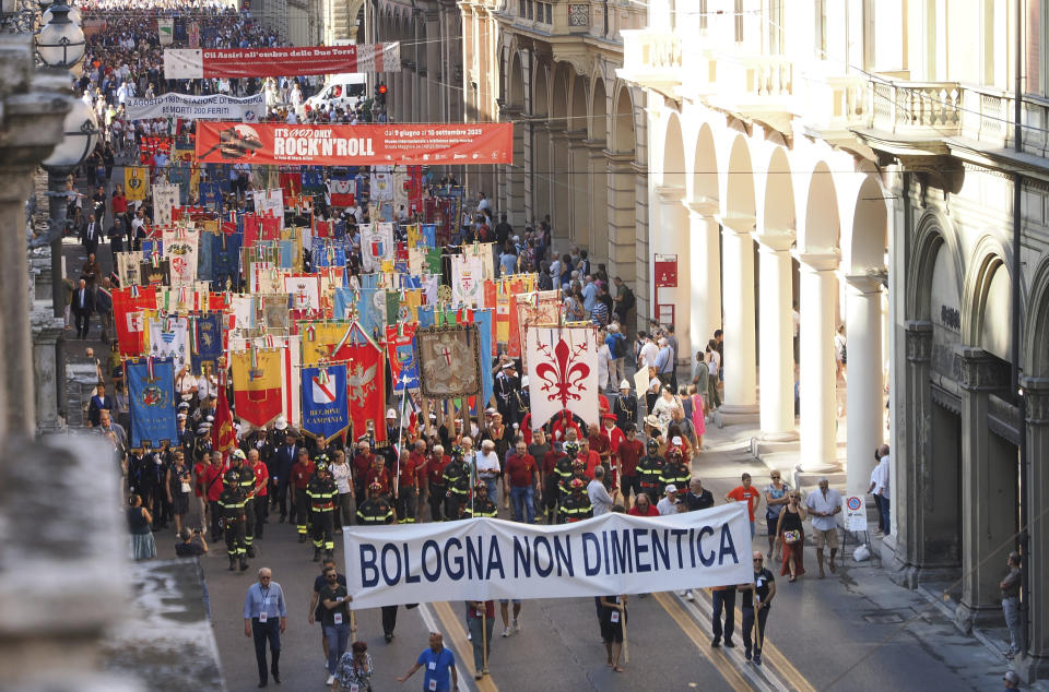 Demonstrators march behind a banner reading: "Bologna doesn't forget" on the 43rd anniversary of the 1980 train station bombing in this central Italian city, Wednesday, Aug. 2, 2023. When Giorgia Meloni was running to become Italy’s first far-right head of government since the demise of the country's fascist dictatorship, she steeped her campaign in ideological touchpoints like national sovereignty and “traditional families.” (Michele Nucci LaPresse Via AP)