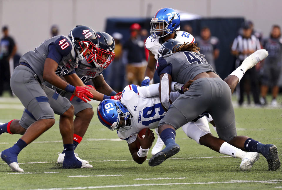 Tennessee State quarterback Geremy Hickbottom (19) gets sacked by Jackson State during the Southern Heritage Classic NCAA college football game in Memphis, Tenn., Saturday, Sept. 11, 2021. (Patrick Lantrip/Daily Memphian via AP)