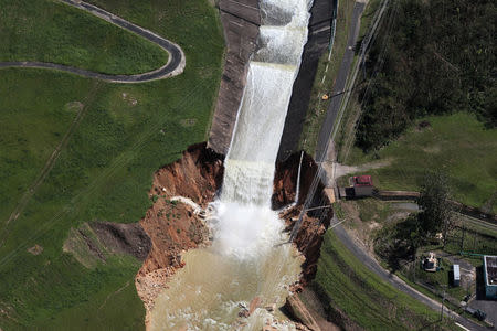 An aerial view shows the damage to the Guajataca dam in the aftermath of Hurricane Maria, in Quebradillas, Puerto Rico September 23, 2017. REUTERS/Alvin Baez