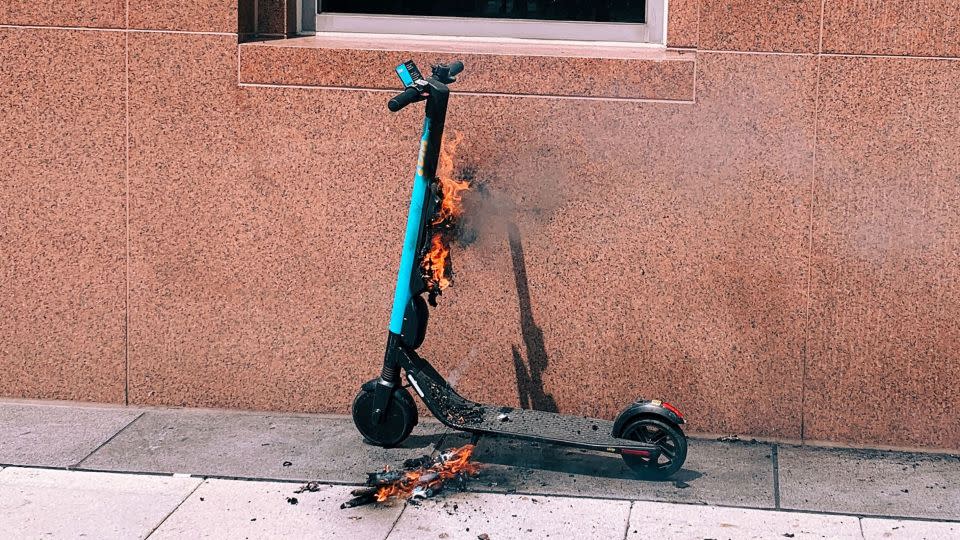 A Skip electric scooter on fire on the corner of 13th Street NW and I Street NW on May 30, 2019. - Olivier Laurent/The Washington Post/Getty Images