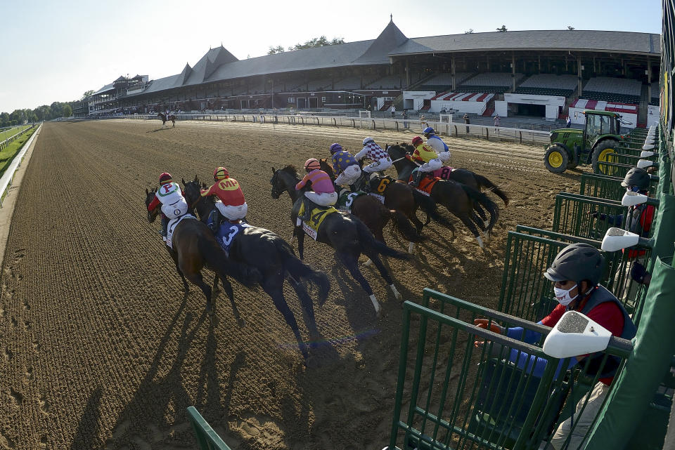 In a photo provided by the NYRA, thoroughbreds break out of the starting gate during the Travers Stakes horse race at Saratoga, Saturday, Aug. 8, 2020, in Saratoga Springs, N.Y. Tiz the Law (6), with Manny Franco up, won the race. (Chelsea Durand/NYRA via AP)