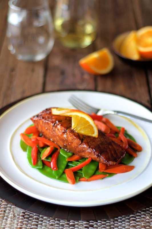 <p>From A Chef's Kitchen</p><p>Have some heat to kick off your night with this salmon and fresh vegetables are topped with a slightly spicy fruity glaze.</p><p><strong>Get the recipe: <a href="https://www.fromachefskitchen.com/pomegranate-orange-glazed-salmon-stir-fried-vegetables/" rel="nofollow noopener" target="_blank" data-ylk="slk:Pomegranate and Orange-Glazed Salmon with Stir-Fried Vegetables;elm:context_link;itc:0;sec:content-canvas" class="link rapid-noclick-resp">Pomegranate and Orange-Glazed Salmon with Stir-Fried Vegetables</a></strong></p>