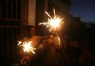 <p>Haitian children wait until nightfall on Christmas Eve to light up <span class="redactor-unlink">Pi detwal (translated as “rain of stars”)</span> which are sparklers or other fireworks. </p>