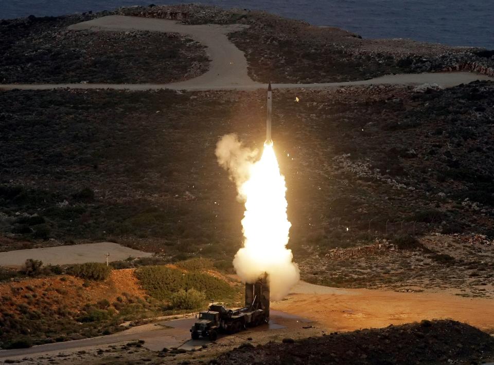 An S-300 anti-aircraft missile launches during a Greek army military exercise near Chania on the island of Crete on December 13, 2013.
