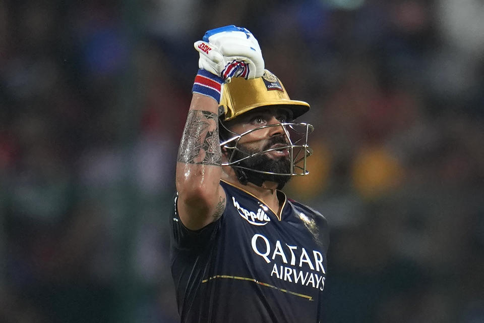 Royal Challengers Bangalore's Virat Kohli celebrates scoring fifty runs during the Indian Premier League cricket match between Royal Challengers Bangalore and Mumbai Indians in Bengaluru, India, Sunday, April 2, 2023. (AP Photo/Aijaz Rahi)