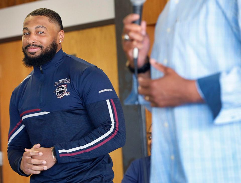 Former Randolph High football standout Fabian Thames, 23, signs a professional rugby contract with the American Raptors in Colorado in front of many Randolph High athletes on Thursday, May 5, 2022.