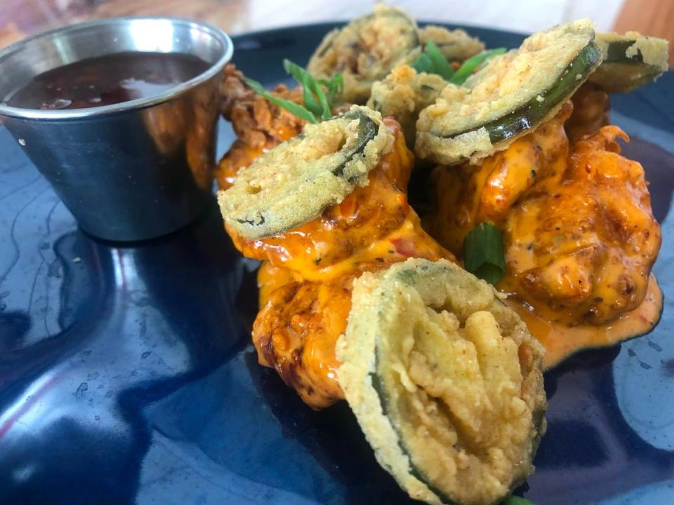 Flamingo Landing’s Flamingo Chicken Bombs, which are fried chicken pieces and fried jalapeños in Go-Go Sauce with a side of crystal gastrique, which is similar to a sweet and sour sauce.