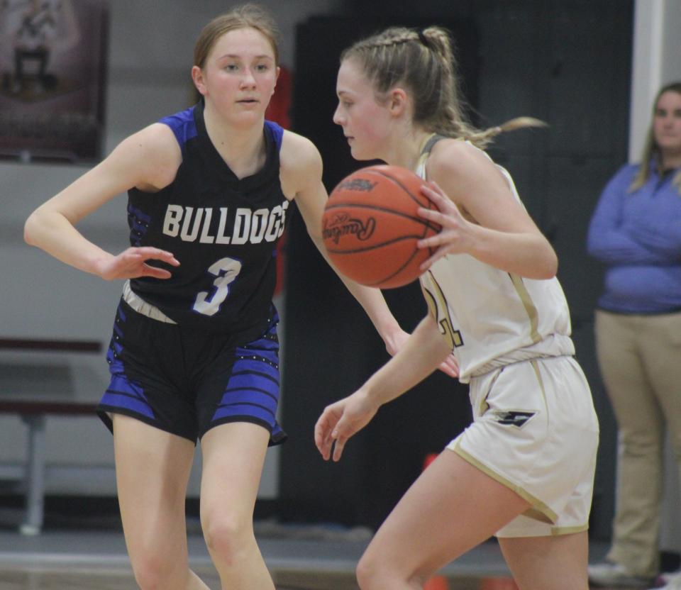 Inland Lakes freshman Elizabeth Furman (3) defends St. Ignace's Jillian Frasier during the first half of Monday's regional semifinal at Harbor Light.