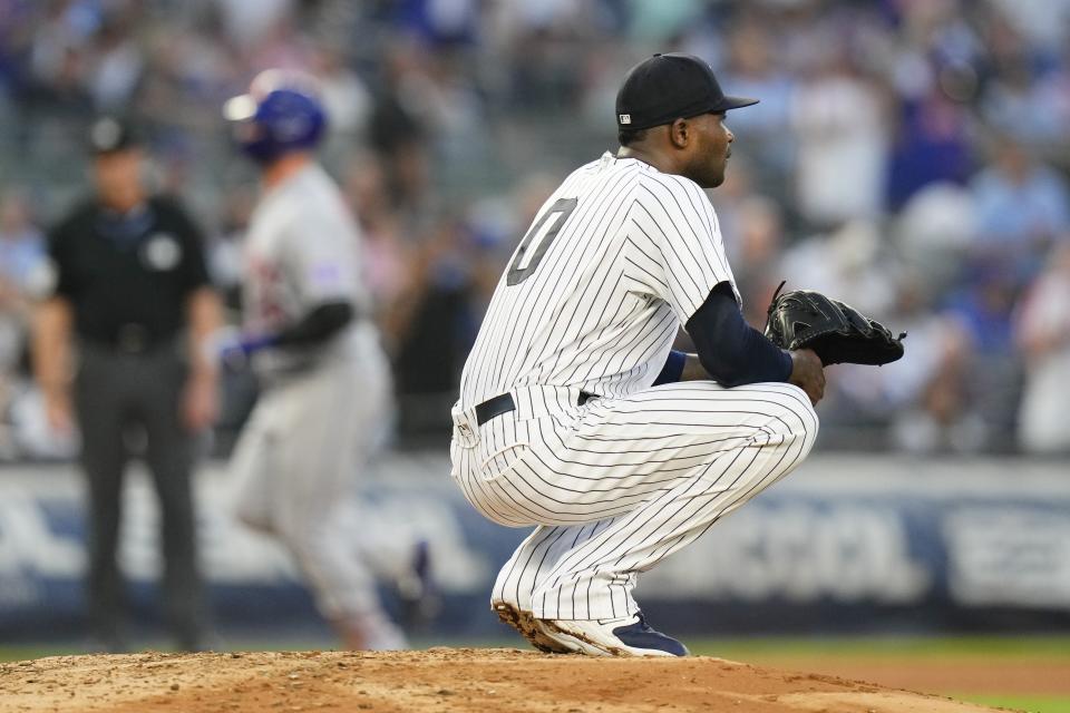 New York Yankees starting pitcher Domingo German (0) reacts as New York Mets' Pete Alonso runs the bases after hitting a three-run home run during the third inning of a baseball game, Tuesday, July 25, 2023, in New York. (AP Photo/Frank Franklin II)