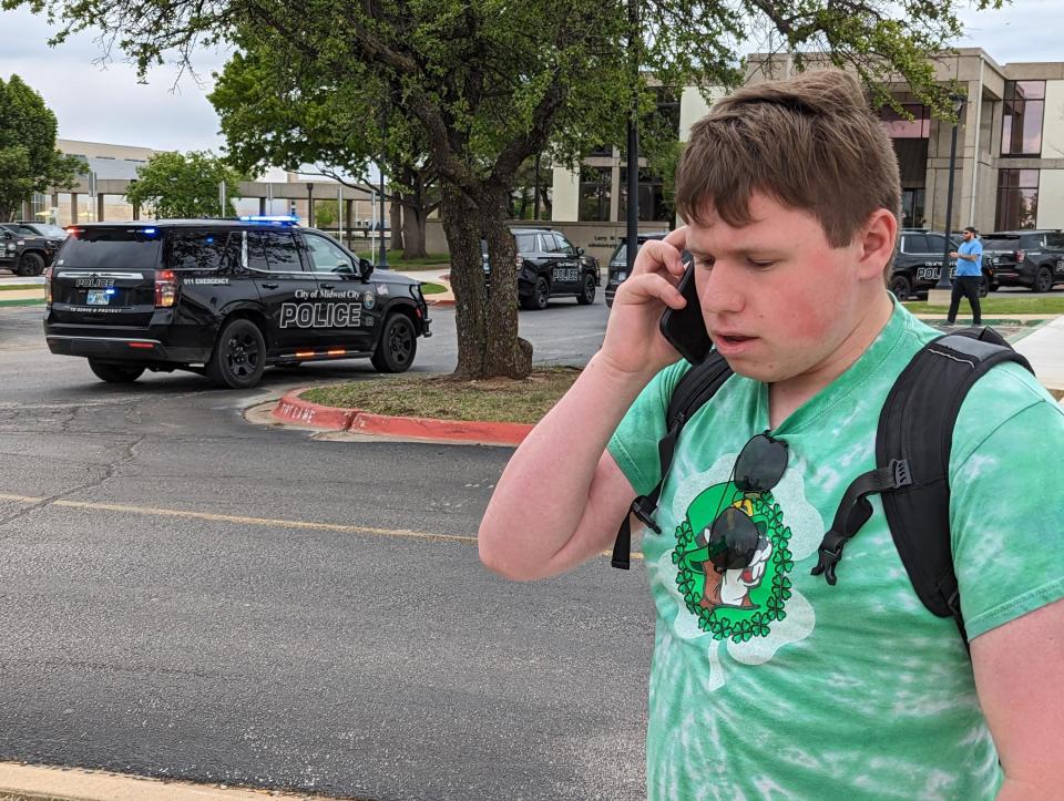 Kevin McCormack, 19, speaks to a reporter by phone Monday after a shooting at Rose State College. McCormack witnessed the shooting and worked to get others into classrooms and out of possible harm's way.