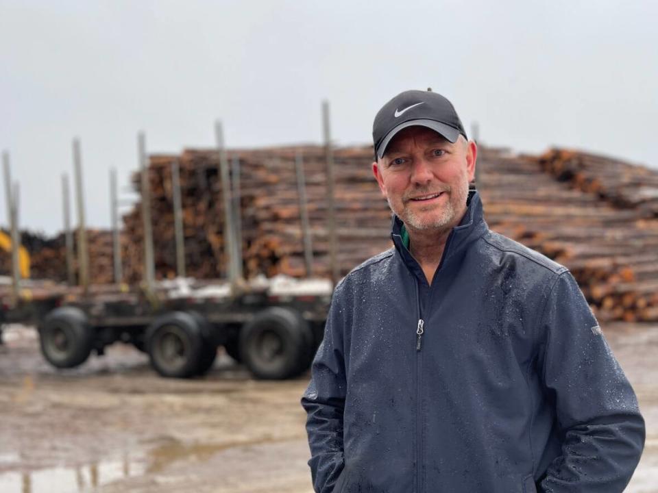 Greg Penney, CEO of J.P. Forestry, couldn't stop smiling on Monday as the wood cut from the Muskrat Falls project was being loaded on a ship headed for Asia.  (Regan Burden/CBC - image credit)
