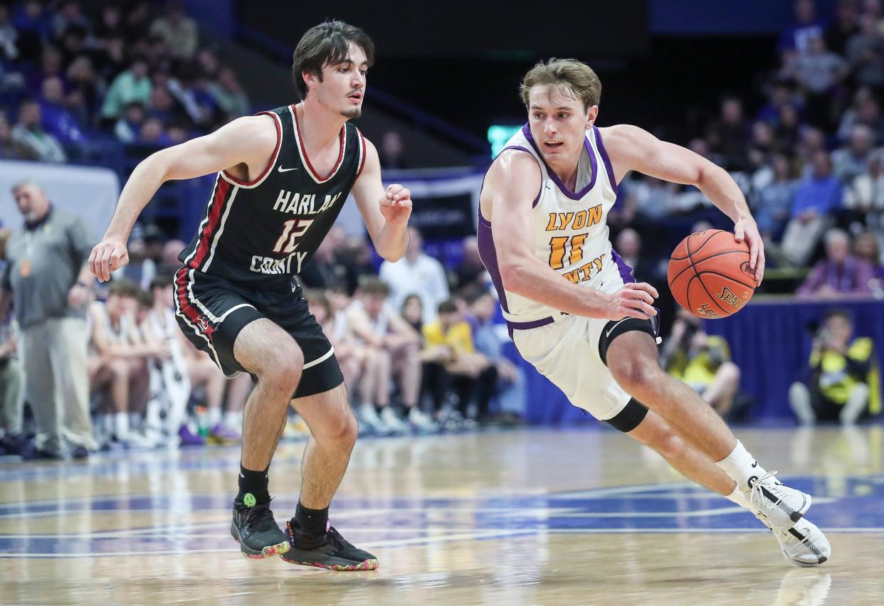 Lyon County's Travis Perry drives on Harlan County's Caleb Johnson. Perry scored a game-high 27 points Saturday in Lexington.