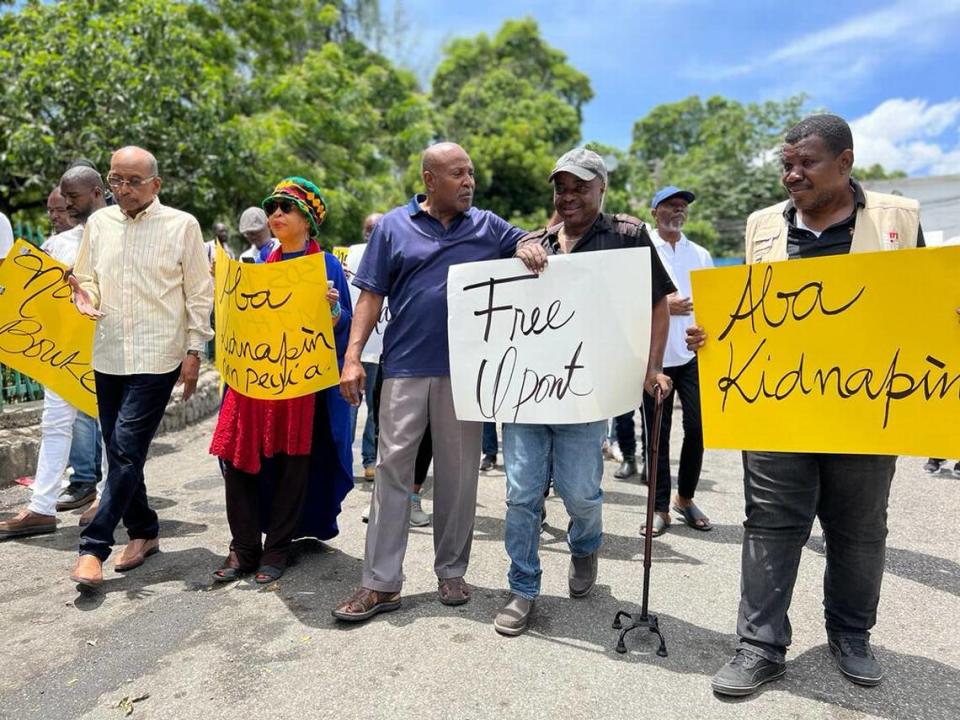 Liliane Pierre-Paul, an award-winning Haitian journalist and radio station owner, at a July 16, 2023 protest demanding the release of kidnapped journalist, Pierre-Louis Opont. She is joined by other journalist including Mavel Dandin, to her left. Dandin and she co-founded Radio Kiskeya in Port-au-Prince.