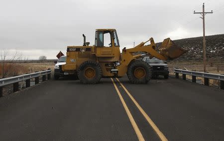 Heavy equipment set up by the occupiers as a roadblock remains on the road leading to the headquarters to the Malheur National Wildlife Refuge outside Burns, Oregon February 12, 2016. REUTERS/Jim Urquhart