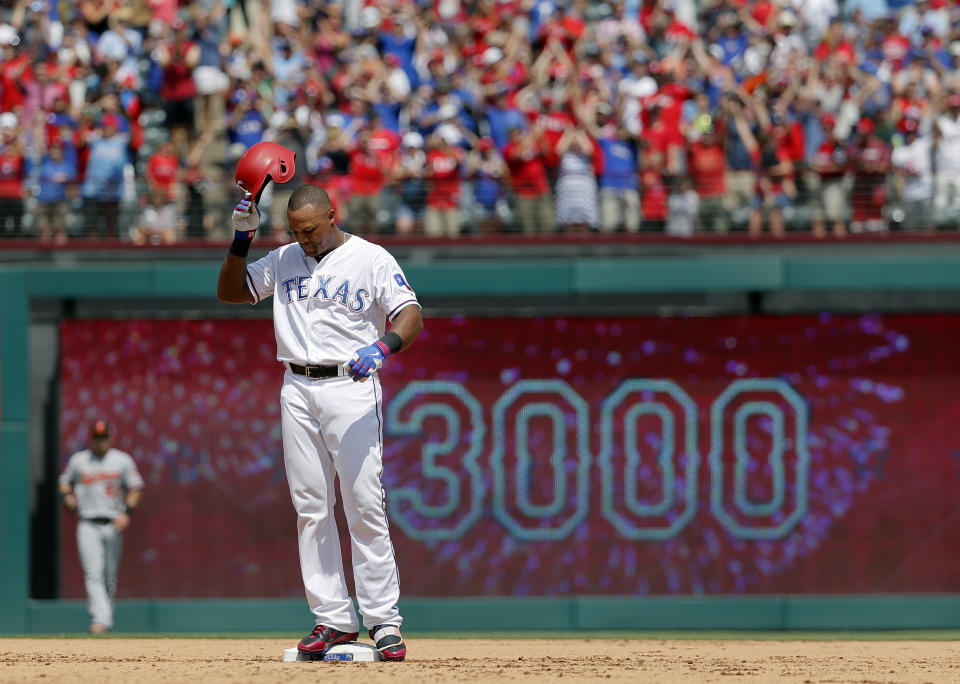 FILE - Texas Rangers' Adrián Beltré tips his helmet as he acknowledges cheers after hitting a double for his 3,000th career hit that came off a pitch from Baltimore Orioles' Wade Miley in the fourth inning of a baseball game, July 30, 2017, in Arlington, Texas. Beltré will be inducted Sunday, July 21, 2024, into baseball’s Hall of Fame in Cooperstown, N.Y. (AP Photo/Tony Gutierrez, File)