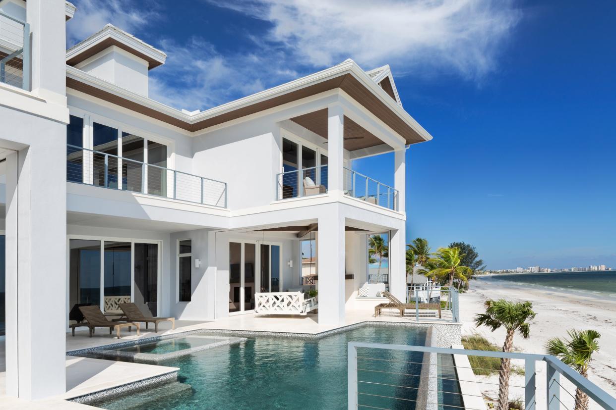 Fort Myers Beach lots are much bigger. This gives builders a chance to create outdoor space with separate areas for a pool and then for the outdoor kitchen, sitting and dining areas.