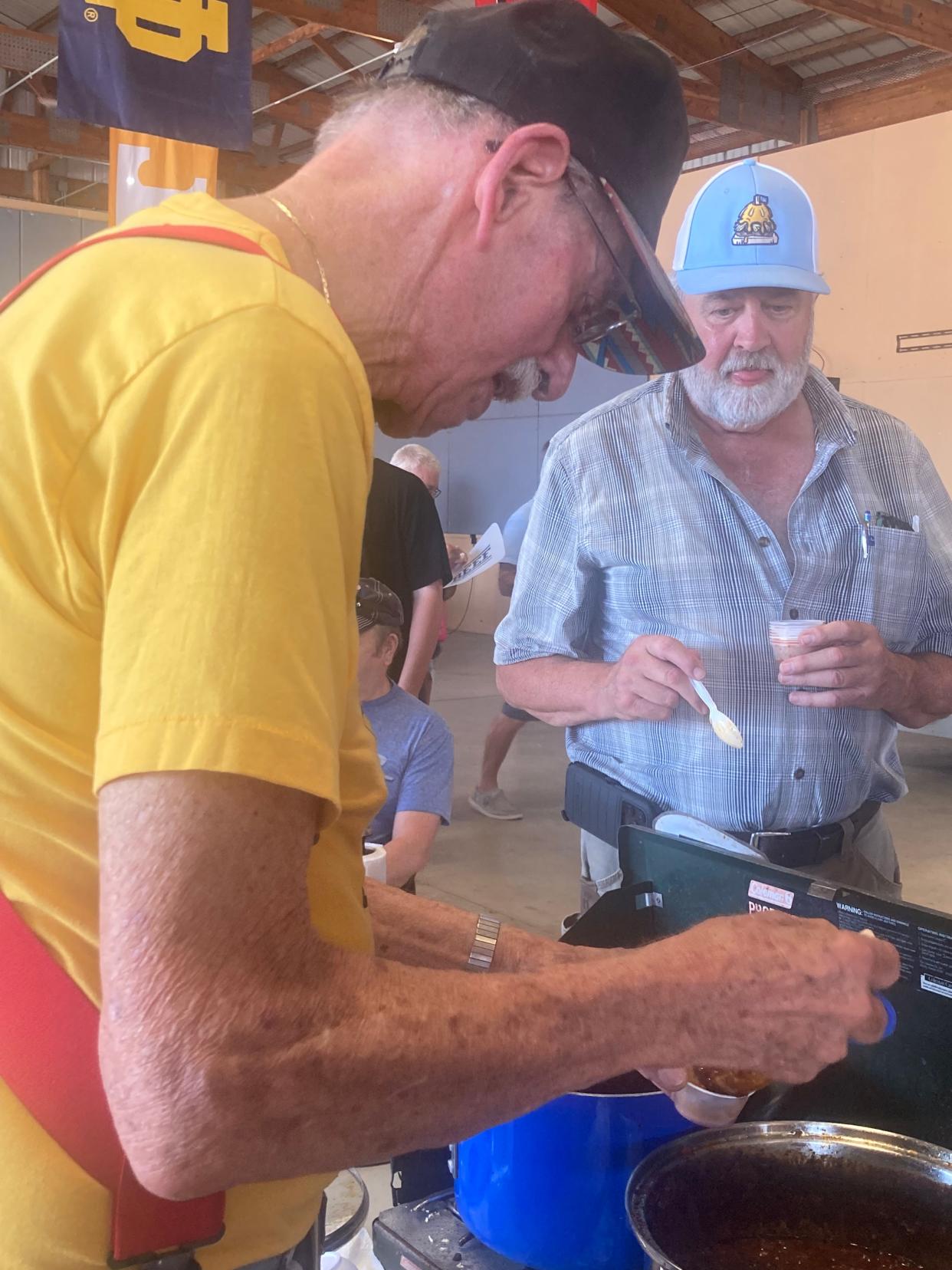 Les Eastep of Springfield doles out some chili at the Illinois State Fair Chili Cookoff at The Shed Sunday. Eastep won the homestyle category, meaning he will take part in the in the World Championship Chili Cook-off in Myrtle Beach, South Carolina, in 2024.