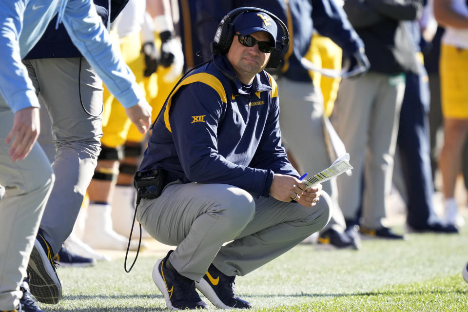 West Virginia head coach Neal Brown watches from the sideline during the first half of an NCAA college football game against Iowa State, Saturday, Nov. 5, 2022, in Ames, Iowa. (AP Photo/Charlie Neibergall)