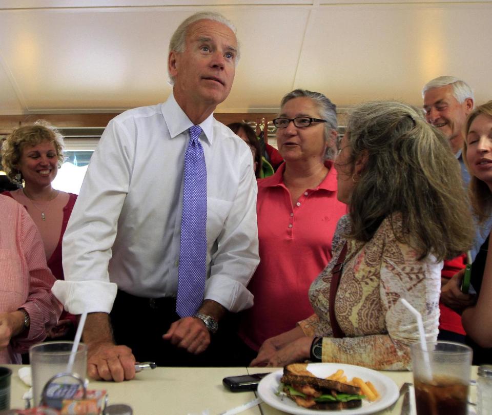 Vice President Joe Biden looks up at the menu during a campaign lunch stop at a diner in Peterborough, N.H., Tuesday, May 22, 2012. (AP Photo/Jim Cole)