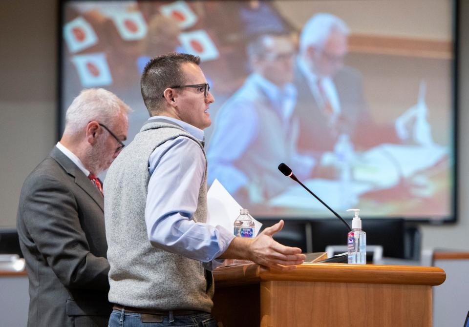 Nathan Boyles, with Adams Sanitation, right, speaks during a meeting of the Santa Rosa County Commission in Milton on Nov. 24, 2020.