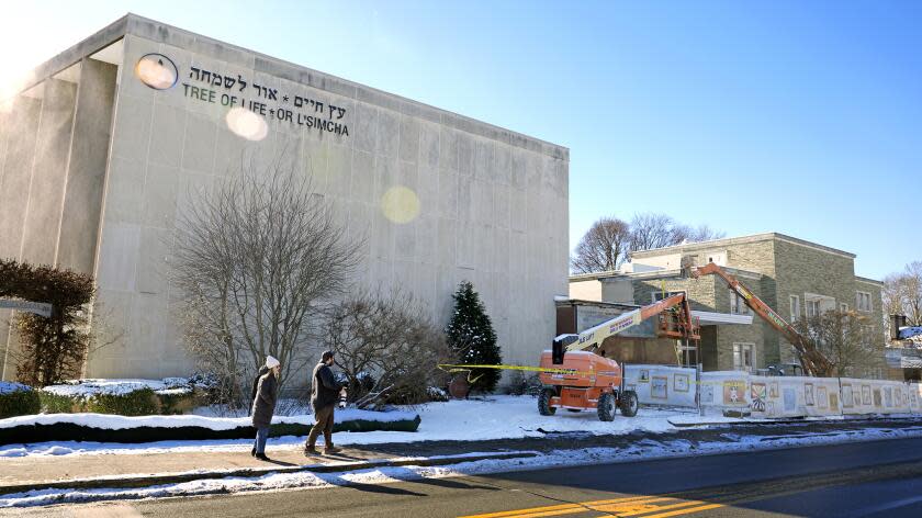 Workers begin demolition Wednesday, Jan. 17, 2023, at the Tree of Life building in Pittsburgh, the site of the deadliest antisemitic attack in U.S. history, as part of the effort to reimagine the building to honor the 11 people who were killed there in 2018. Most the building will be removed, although portions of the sanctuary walls will be preserved. The new building will include spaces for worship and a museum, and will house community activities and an education center. (AP Photo/Gene J. Puskar)