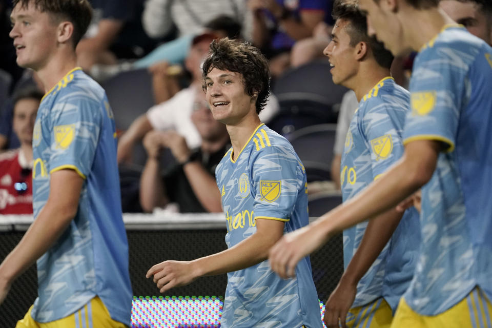 FILE - Philadelphia Union midfielder Paxten Aaronson, center left, celebrates with teammates after scoring a goal during the second half of an MLS soccer match against FC Cincinnati Saturday, Oct. 9, 2021, in Cincinnati. Signed by the Philadelphia Union at 16, Aaronson is now 18 and poised for a breakout. (AP Photo/Jeff Dean, File)