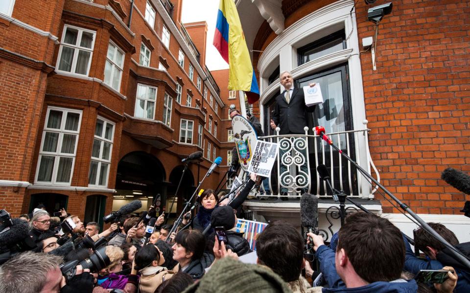 Assange addresses supporters from the balcony of Ecuador's embassy in London in 2016