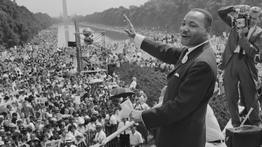 <em>The civil rights leader Martin Luther King waves to supporters 28 August 1963 on the Mall in Washington DC during the “March on Washington.” (Photo by AFP) (Photo by AFP via Getty Images)</em>