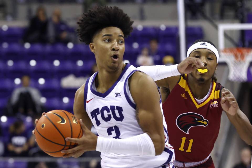TCU guard PJ Haggerty (3) looks to pass the ball as Louisiana-Monroe guard Tyreke Locure (11) defends during the first half of an NCAA college basketball game Thursday, Nov. 17, 2022, in Fort Worth, Texas. (AP Photo/Ron Jenkins)