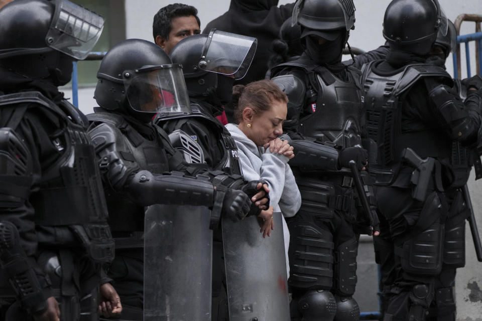 A supporter of former Ecuadorian Vice President Jorge Glas stands outside the detention center where he was taken after police broke into the Mexican Embassy to arrest him, in Quito, Ecuador, April 6, 2024. Glas, who held the vice presidency of Ecuador between 2013 and 2018, was convicted of corruption and had been taking refuge in the Mexican embassy since December. (AP Photo/Dolores Ochoa)