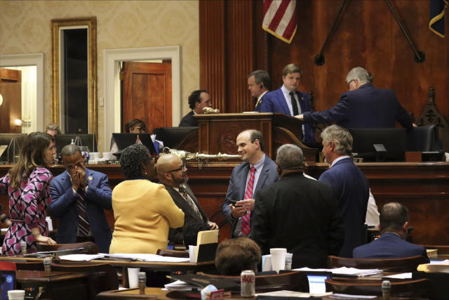 Patrick Dennis, the chief of staff for the South Carolina House Rules Committee, speaks with Democrats amid a computer system reboot during an abortion debate lasting early into the morning on Wednesday, May 17, 2023 in Columbia, S.C. (AP Photo/James Pollard)