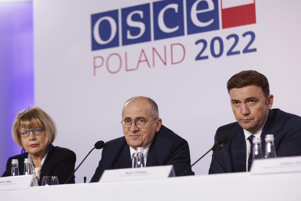 OSCE Secretary General Helga Maria Schmid, left, Polish Minister of Foreign Affairs Zbigniew Rau, center, and Minister of Foreign Affairs of North Macedonia Bujar Osmani, right, attend a press conference after a closing session of a high-level meeting of the Organization for Security and Cooperation in Europe in Lodz, Poland, Friday, Dec. 2, 2022. A security organization born in the Cold War to maintain peace in Europe ended a high-level meeting Friday without a final resolution, underlining the existential crisis it is facing amid Russia's war against Ukraine. (AP Photo/Michal Dyjuk)