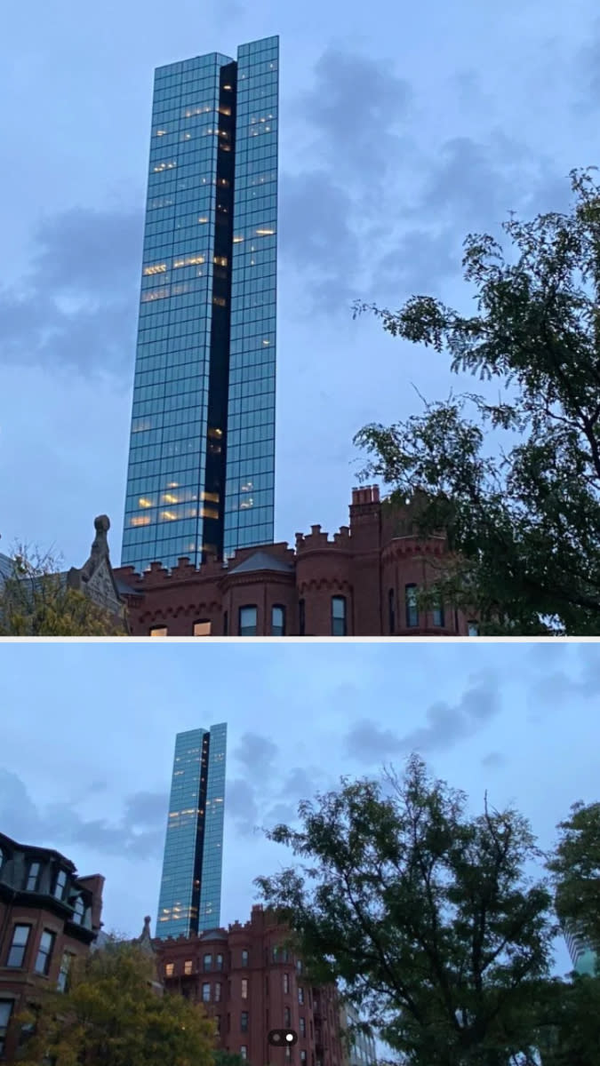 Skyscraper towers over traditional brick buildings against a dusk sky