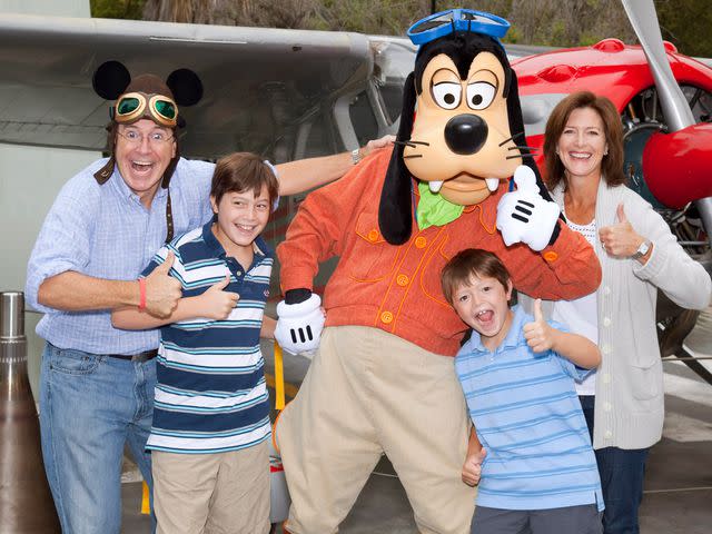 <p>Paul Hiffmeyer/Disney/Getty</p> Stephen Colbert, Evelyn Colbert, and sons Peter and John pose with Goofy at Disney California Adventure park in on August 28, 2010.