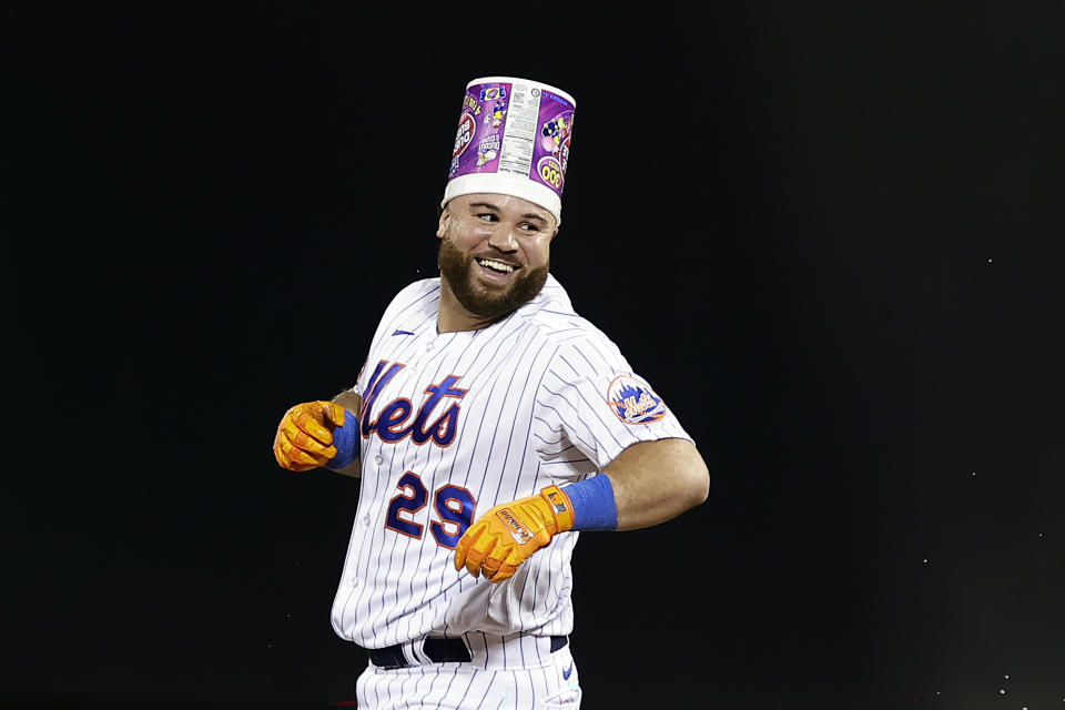 New York Mets' DJ Stewart reacts after being hit by a pitch with the bases loaded, driving in the winning run against the Texas Rangers during the 10th inning of a baseball game Wednesday, Aug. 30, 2023, in New York. The Mets won 6-5. (AP Photo/Adam Hunger)