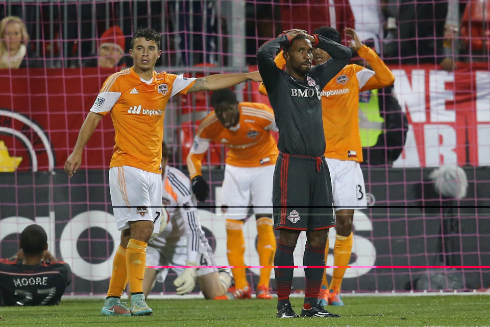 Oct 8, 2014; Toronto, Ontario, CAN; Toronto FC forward Jermain Defoe (18) reacts after a missed scoring opportunity against the Houston Dynamo at BMO Field. The Dynamo beat FC 1-0. (Tom Szczerbowski-USA TODAY Sports)