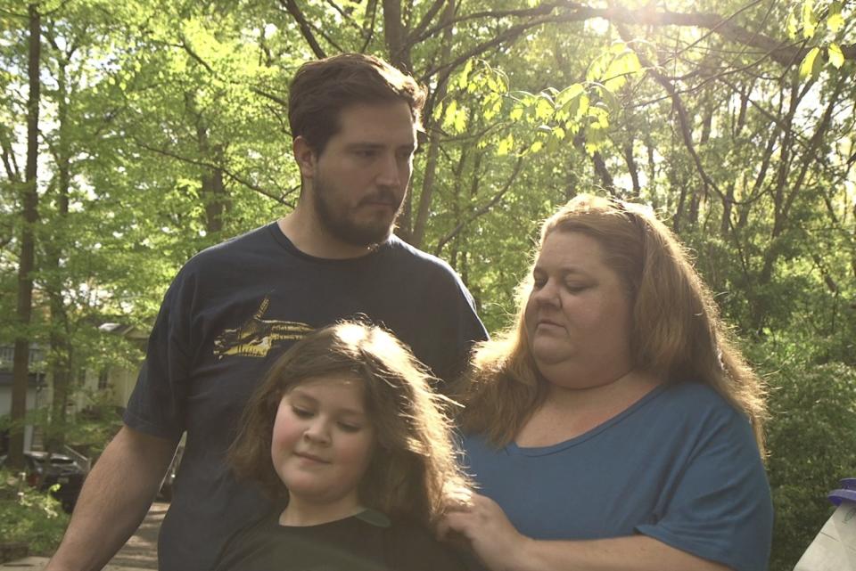 Brandy Swayze, 43, a coronavirus sufferer who created a Facebook survivors group after developing pneumonia, stands with her husband and her daughter in Cabin John, Md.