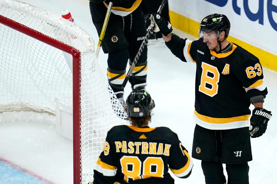 Bruins left wing Brad Marchand celebrates after his goal against Red Wings goaltender Ville Husso during the third period of Thursday's game.
