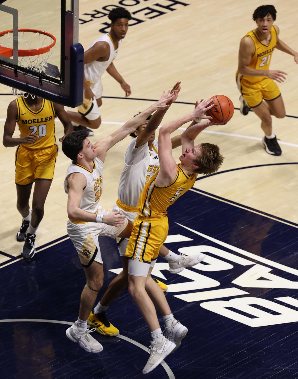 Noah George of Moeller takes a close-range shot for the Moeller offense in the first quarter against Centerville in the Division I regional final March 16, 2024. Centerville won in double overtime 70-69.